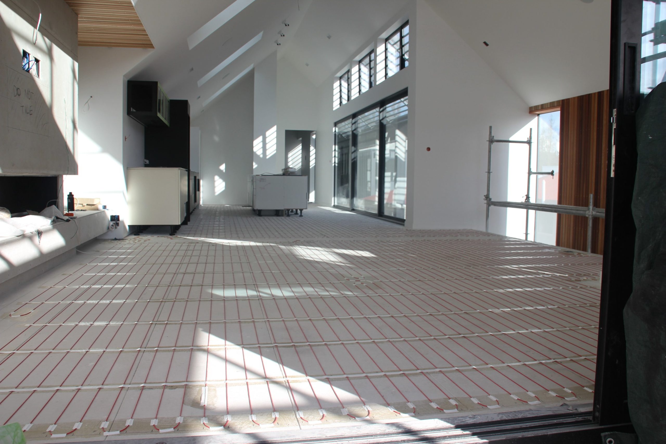 Installation of Thermafloor diy under tile heating systems, New Zealand. See the cost comparison between electric and hydronic